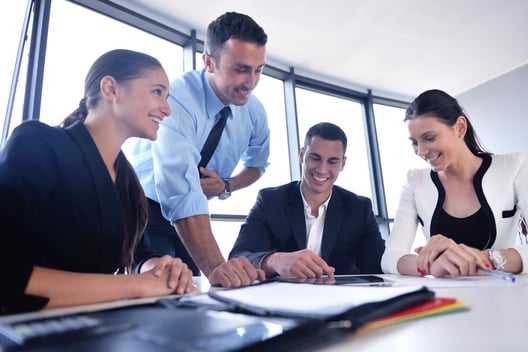 Group of happy young  business people in a meeting at office.jpeg